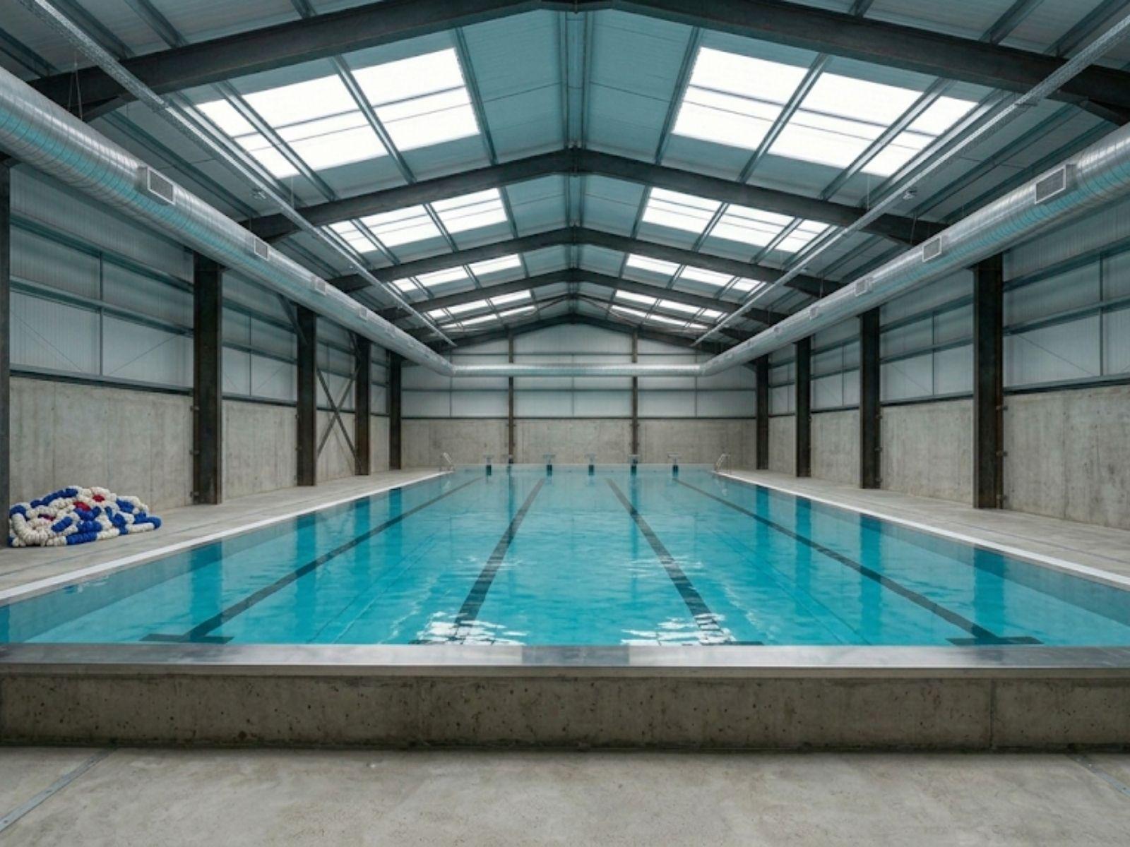 Freestanding above-ground structural vessel in warehouse shell